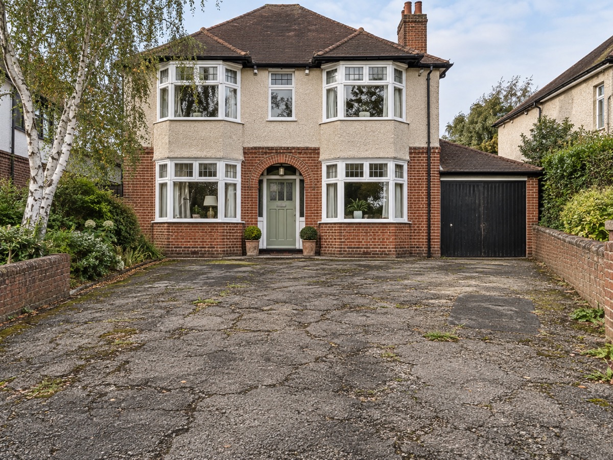 Illustrative before view of an old cracked tarmac driveway